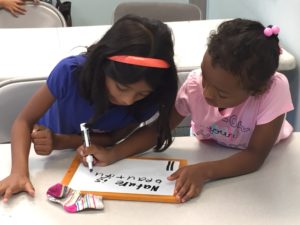 students write silly sentences on their whiteboards