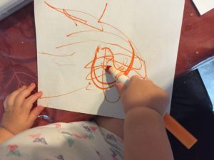 toddlers use markers to color