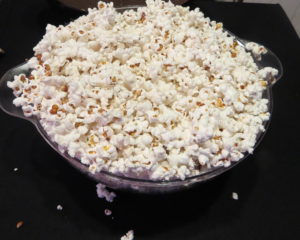 a bowl overflowing with popcorn