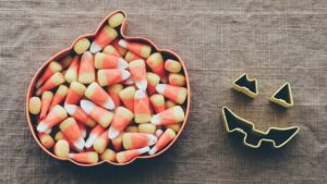 Candy corn in a pumpkin shaped bowl