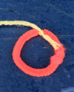 the yarn tied to the circle