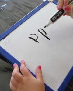 a student draws the letter P two time