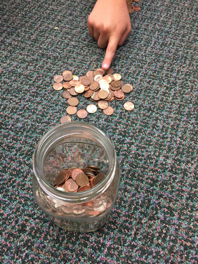 a student taking a penny for each fact that she says