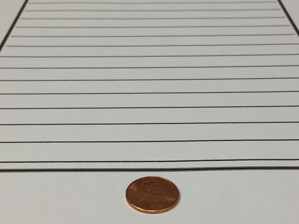 a penny glued to the bottom of the student's paper