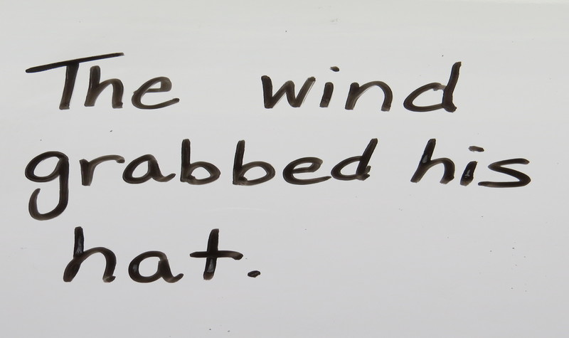 The sentence, "The wind grabbed his hat."