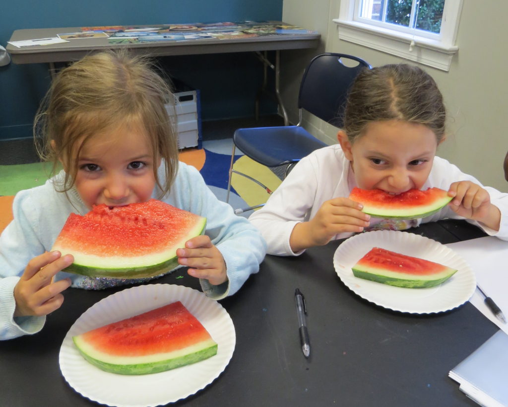 Kids eating watermelon