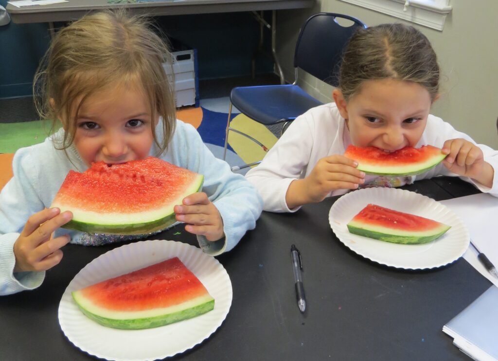 Kids eating watermelon