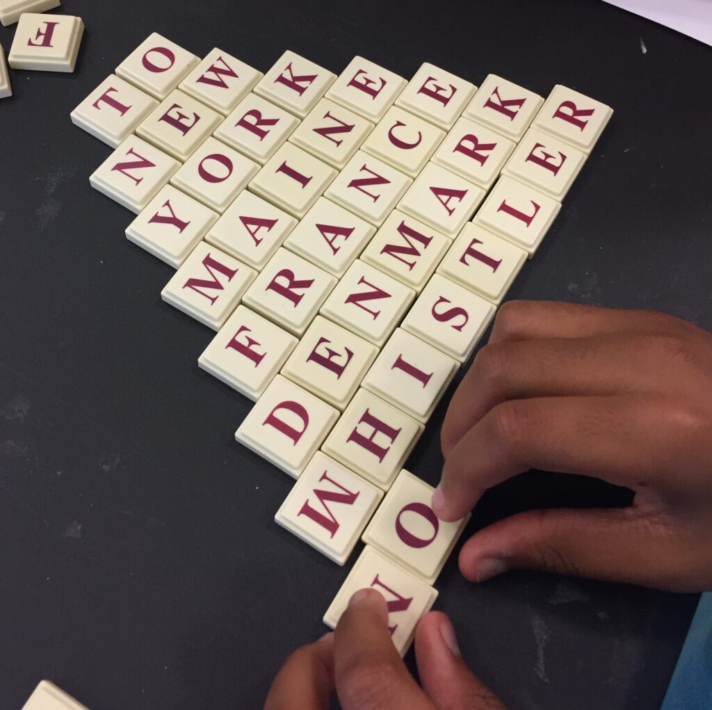 Students are building a pyramid with letter tiles, persuasive writing prompt for kids